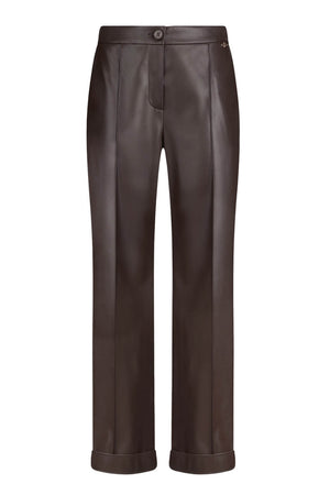 Pantaloni da donna in ecopelle con logo metallico fronte