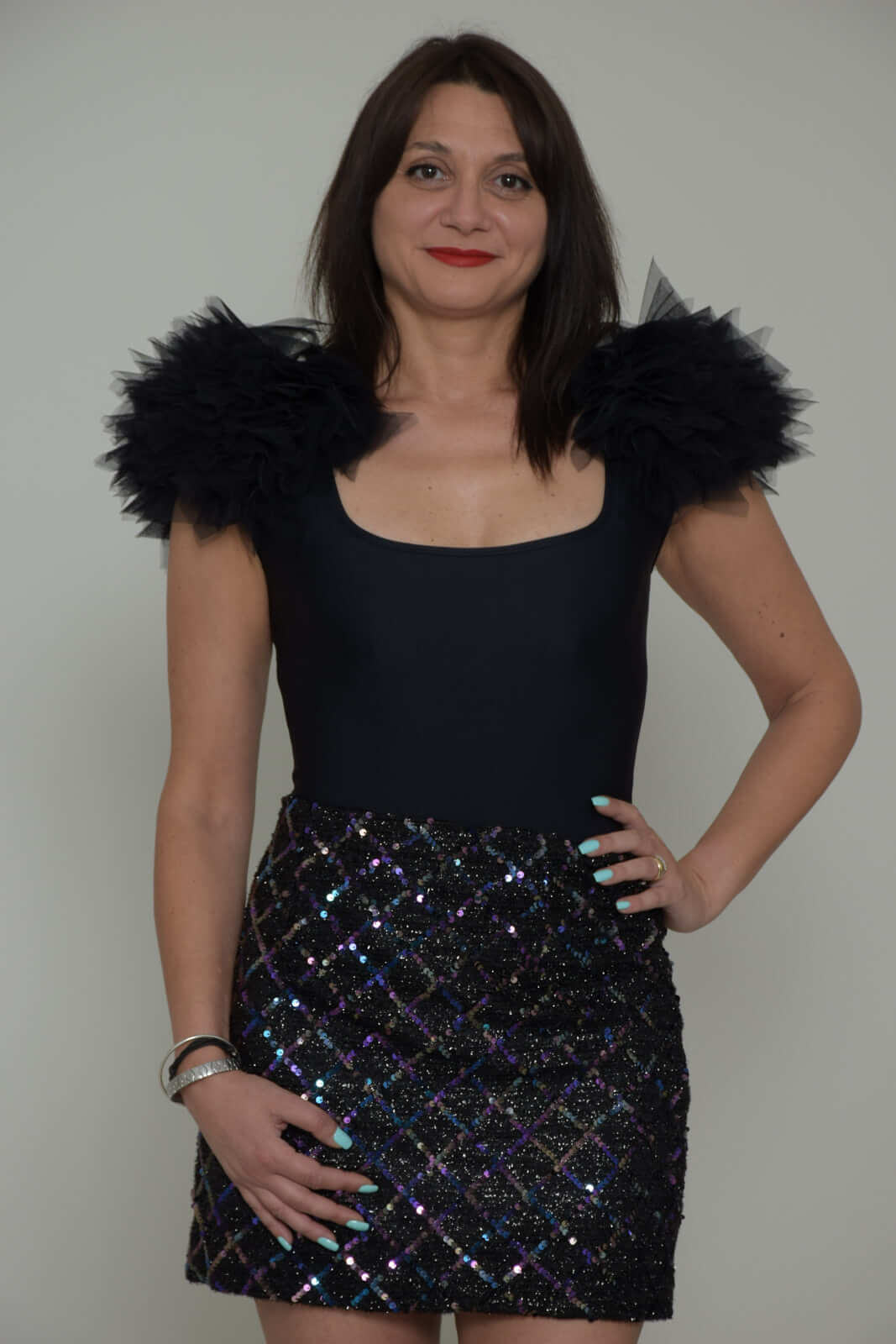 Revise Body Women with pom poms on the shoulders