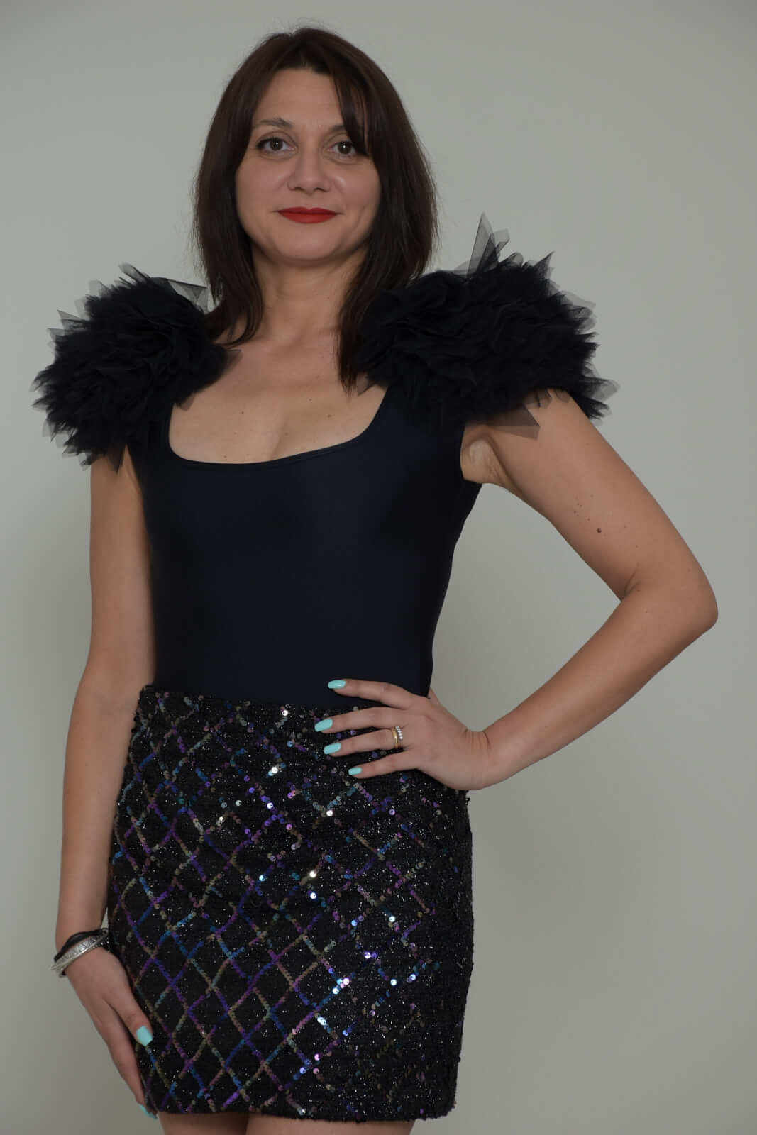 Revise Body Women with pom poms on the shoulders